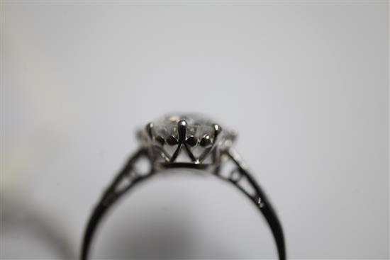 A 1940s/1950s platinum and single stone diamond ring with diamond set shoulders, size L.